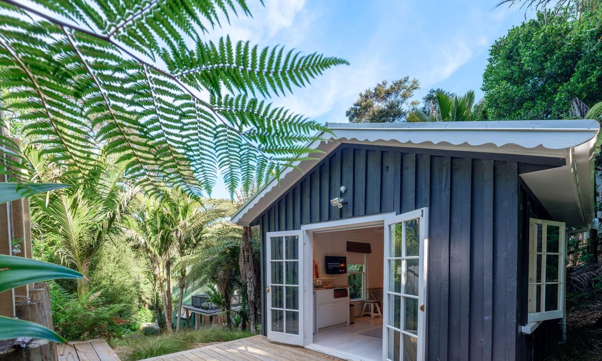 Ostend Cottage | Enchanted Valley - Enchanted Valley is a gorgeous cottage plus cabana in the heart of Waiheke Island. Located in a peaceful valley section, the sound of the birds is your constant companion. With two bedrooms and four beds, this is perfect for up to