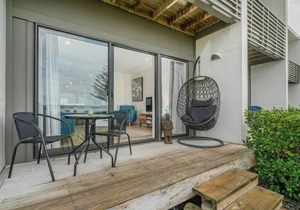 Modern beach front apartment at Aqua Soleil complex with lap pool & spa.