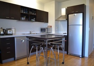 Upstairs fully self contained apartment with a queen bedroom.
