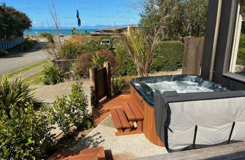 Marahau House | Bach 7 by The Sea - Spa Pool and Views