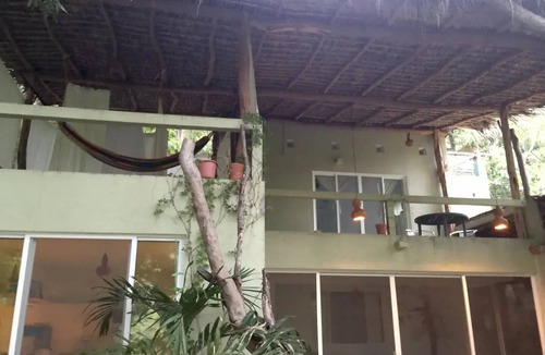 Arroyo Cruz House | Great room with deck pool in front of perfect bay