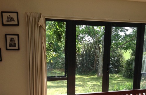 Raglan House | Okete Landing - Lifestyle retreat on Raglan harbour with grass tennis court.