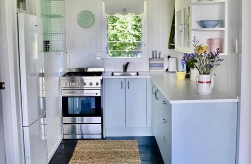 Stanmore Bay Cottage | Rosie's cottage in Stanmore Bay , a short walk to beach with a great seaview.