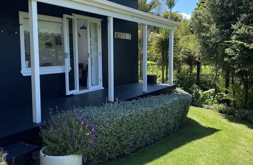 Stanmore Bay Cottage | Rosie's cottage in Stanmore Bay , a short walk to beach with a great seaview.