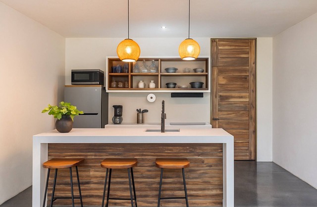 1-Bed Condo Kitchen Island Pool Views